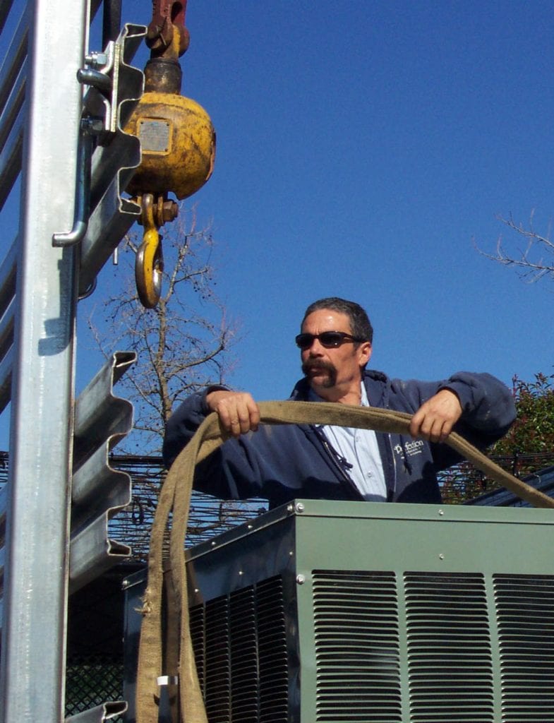 PHS employee on crane lift
