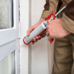 caulking to seal air leaks around window frames